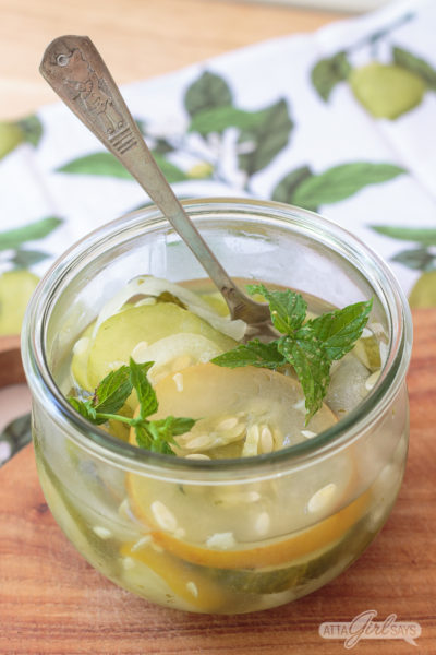 Weck jar of freezer pickles garnished with mint leaves
