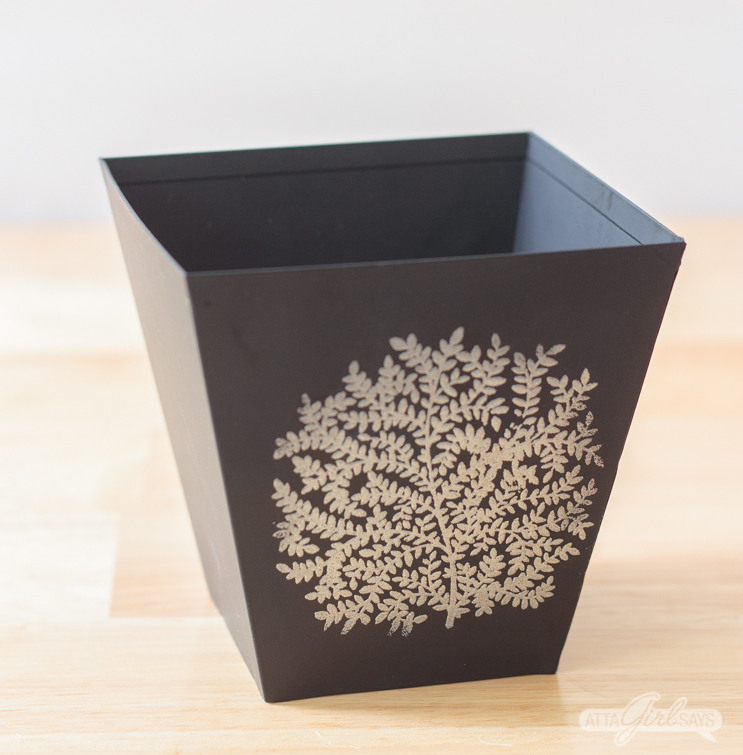black metal cachepot with an embossed silver tree design