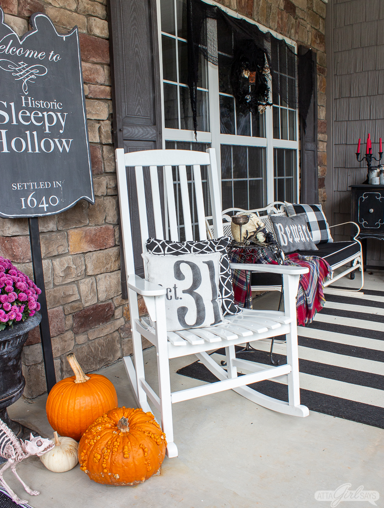 rocking chair and Sleepy Hollow sign on a front porch for Halloween