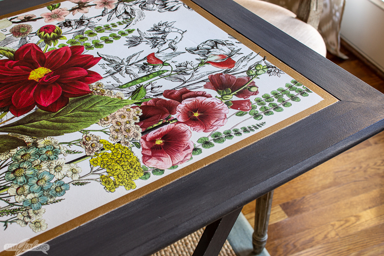 closeup of a folding game table with a floral tabletop