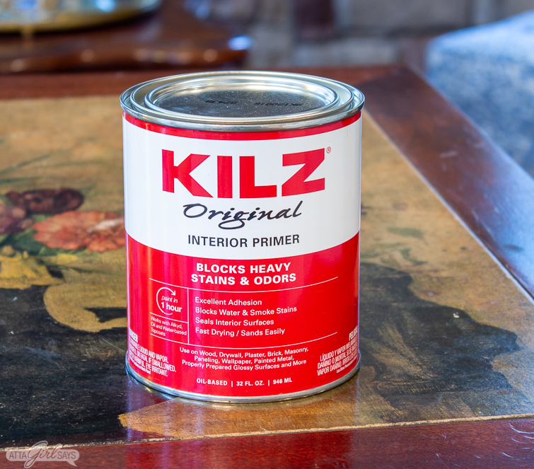can of KILZ primer on a floral tabletop