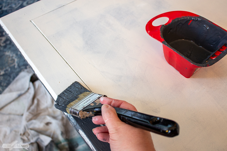 Painting the edge of folding game table after using KILZ to prime it