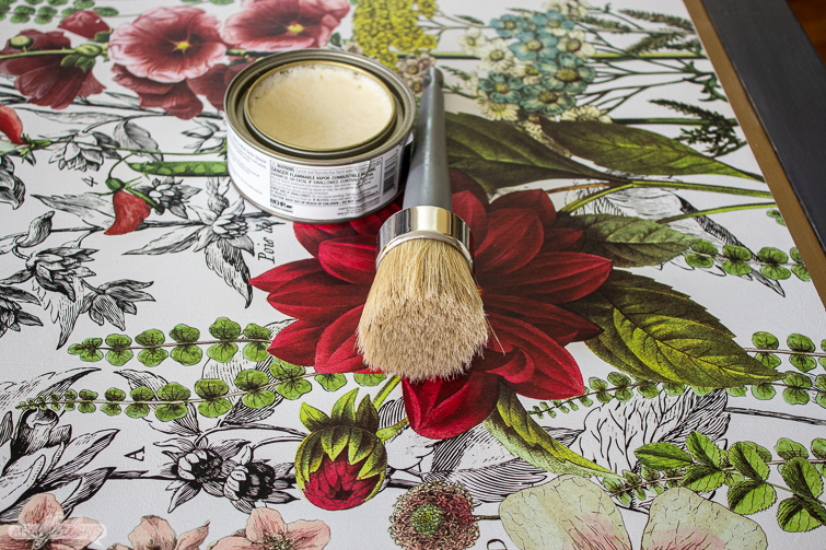 using wax to seal a tabletop embellished with a decorative floral transfer 