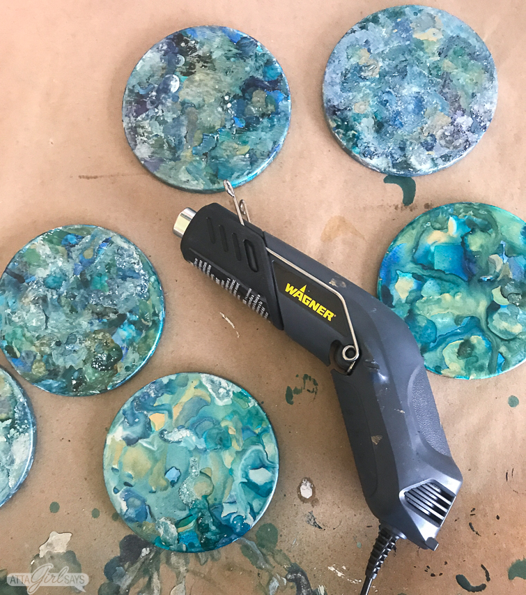 marbleized alcohol ink coasters and a craft heat gun