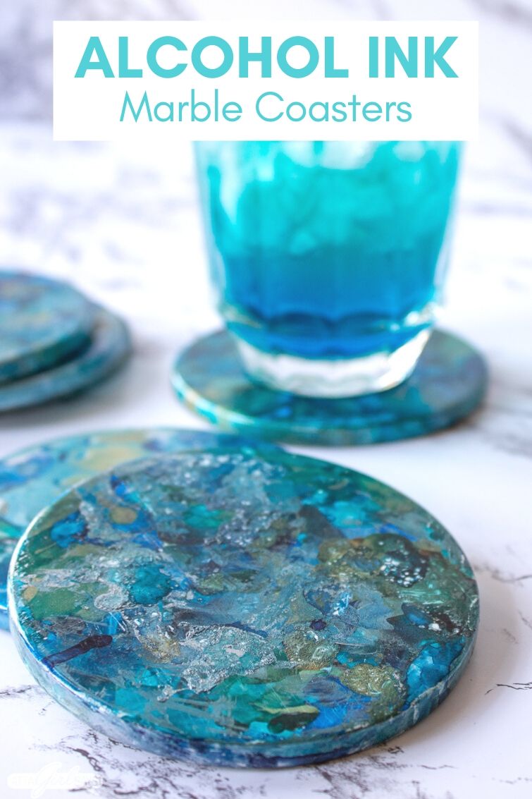marbled alcohol ink coasters with a blue cocktail