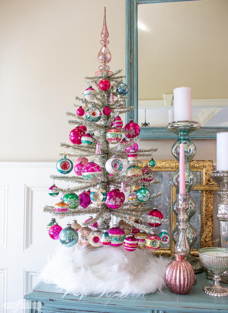 silver tinsel tree decorated with pink and green Shiny Brite Christmas ornaments