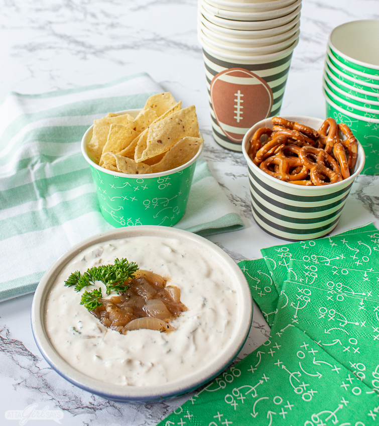 football party food spread with tortilla chips, pretzels and homemade French onion dip
