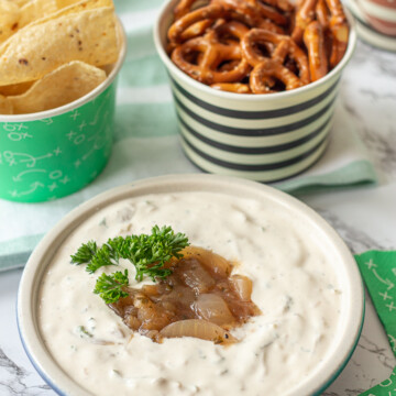 football party food spread with tortilla chips, pretzels and homemade French onion dip
