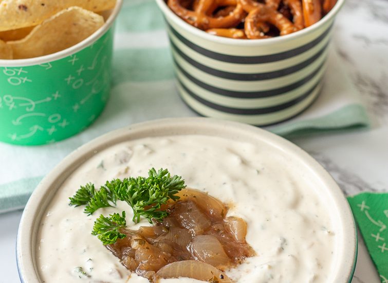 football party food spread with tortilla chips, pretzels and homemade French onion dip