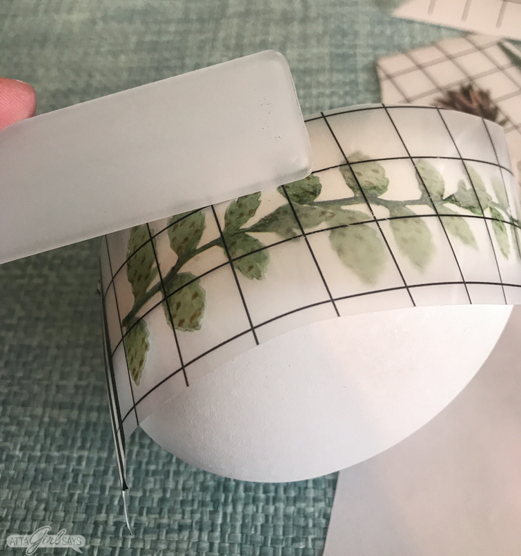 applying a decorative rub on transfer to an Easter egg