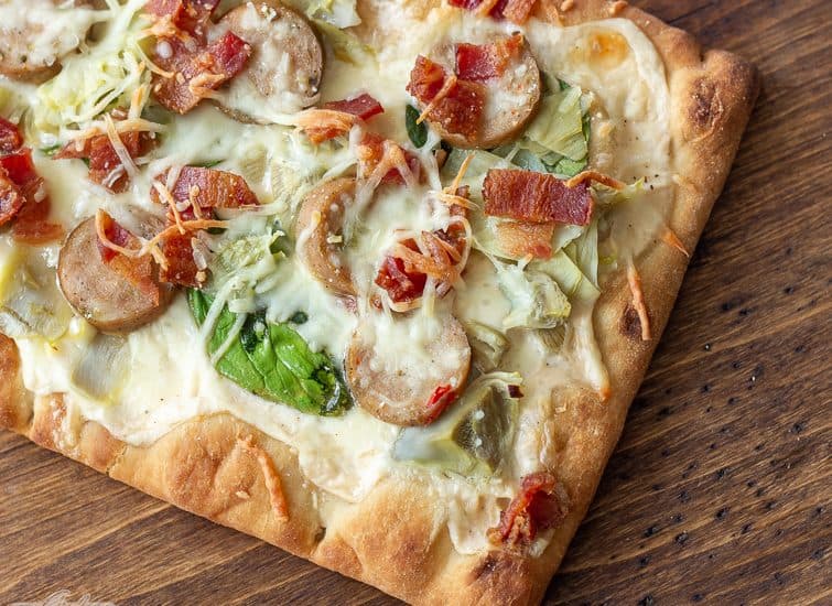 chicken bacon artichoke flatbread flatbread on a pizza peel
