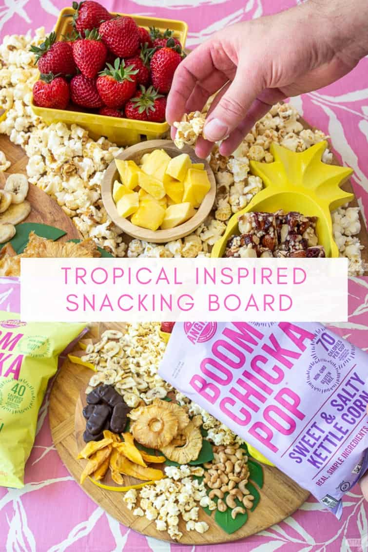 collage photo showing a man taking popcorn from a tropical charcuterie board with fruit, nuts and popcorn
