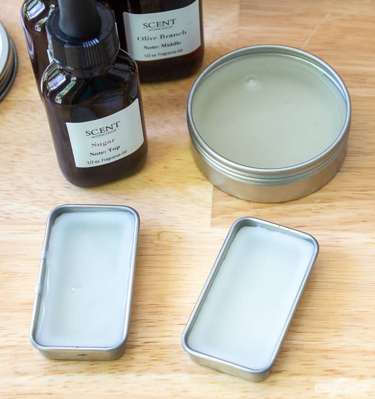 solid perfume in metal tins