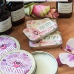 tins of homemade solid perfume with orchid fragrance oil