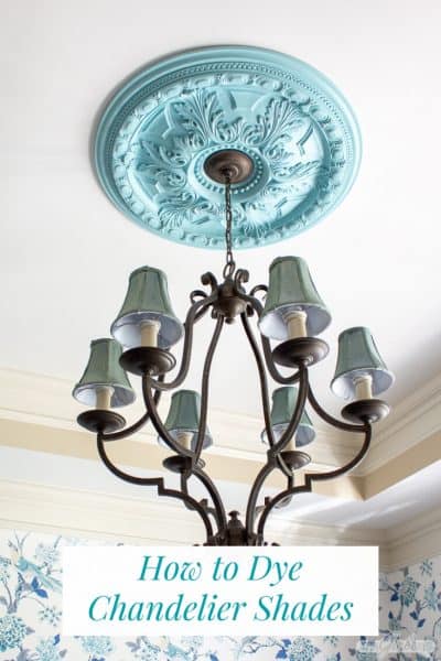 chandelier with blue shades and painted ceiling medallion