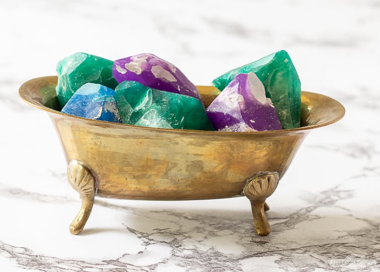 crystal soap gemstones in a brass bathtube soap holder