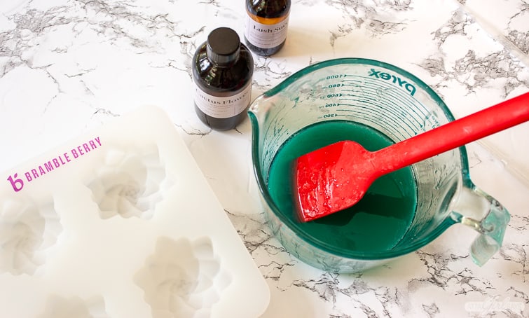 melted green soap with a silicone  soap mold