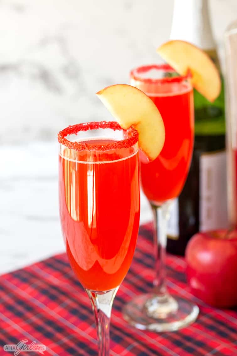 cinnamon apple cider mimosa in a fluted champagne glass