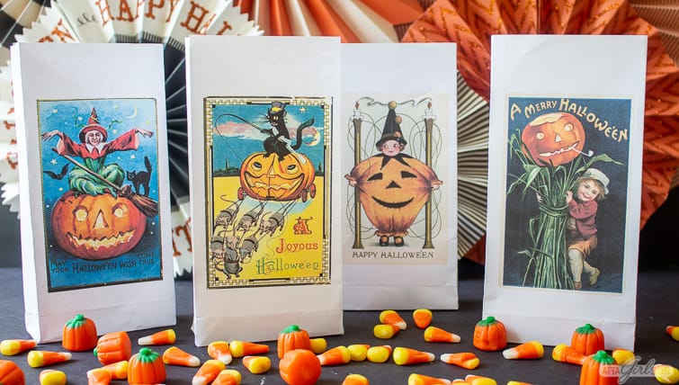 paper trick or treat bags featuring vintage Halloween postcard art