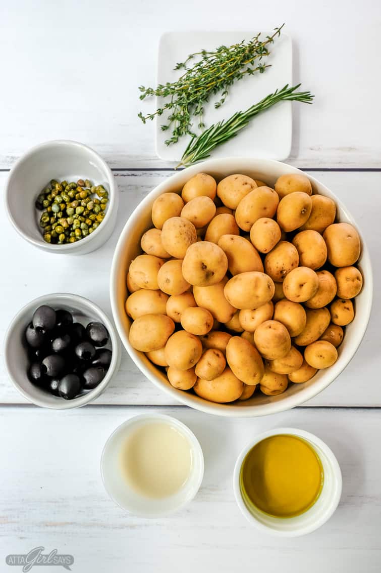 potatoes, capers, olives, olive oil, vinegar and herbs mis en place