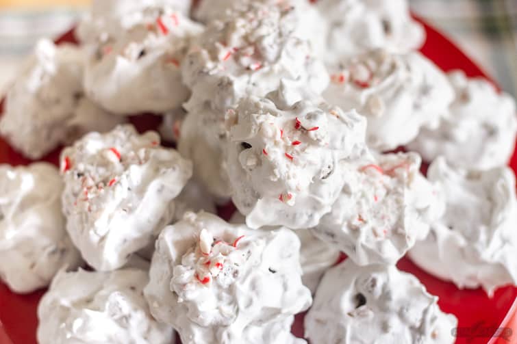 meringue cookies with peppermint candies on a red plate