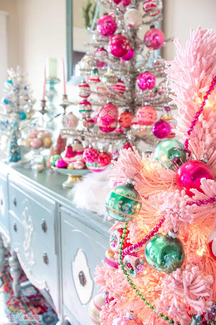 tinsel Christmas trees decorated with vintage Shiny Brite ornaments on a duck egg blue painted buffet