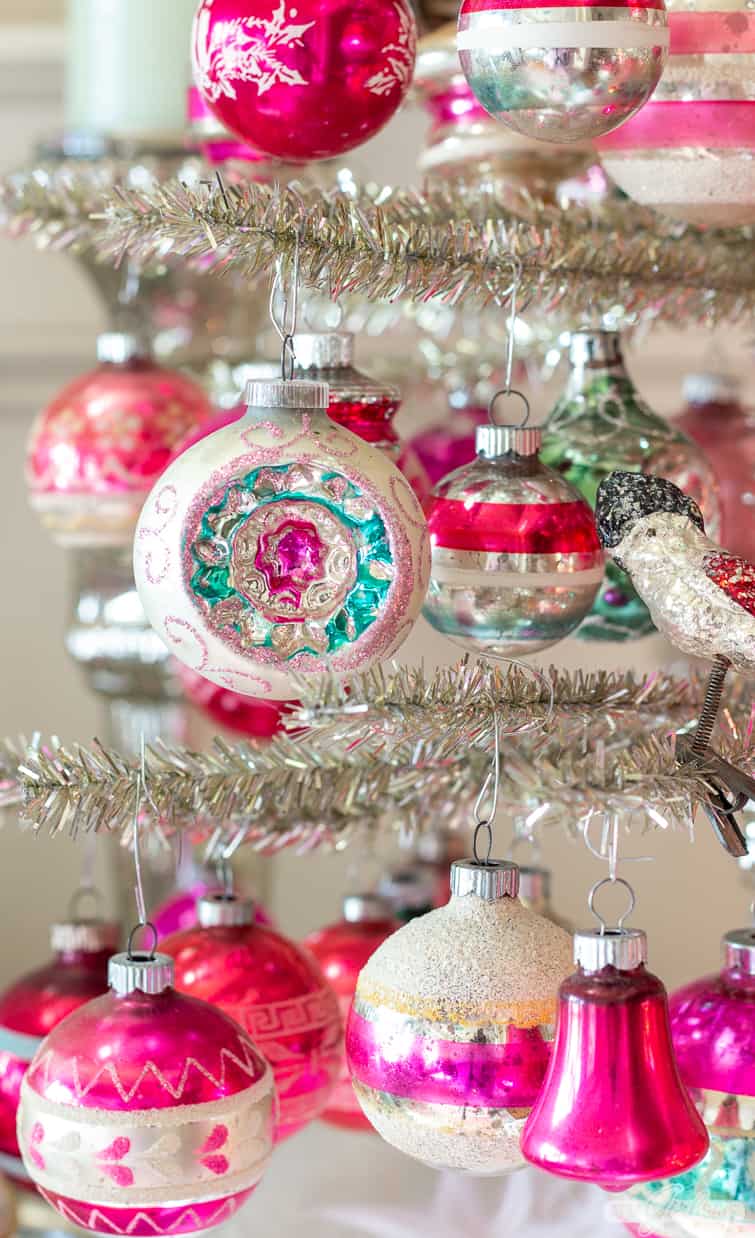 silver tinsel tree decorated with pink and green Shiny Brite ornaments
