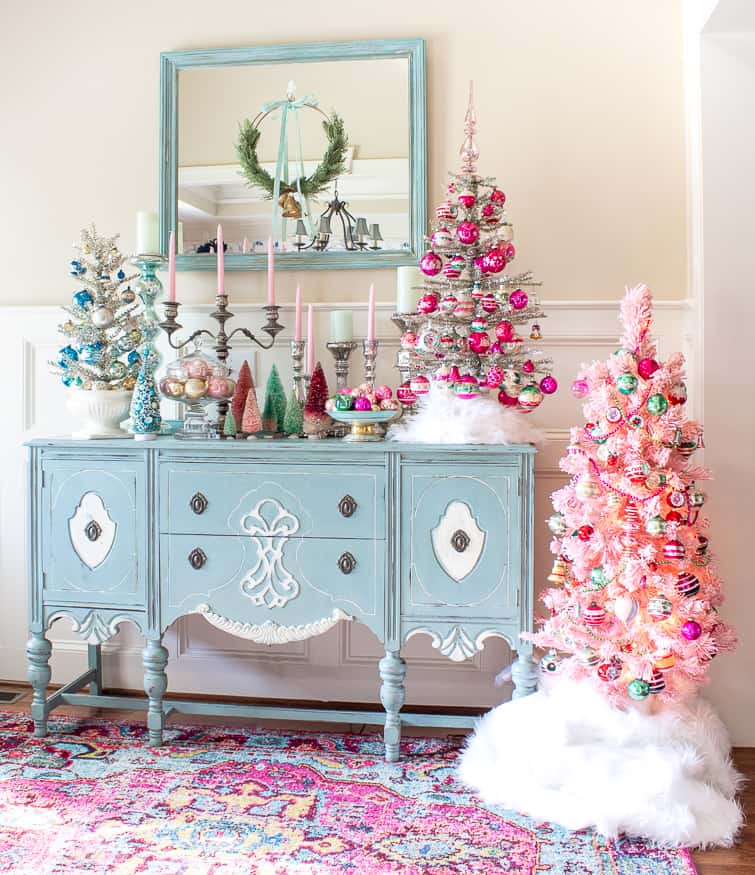 tinsel Christmas trees decorated with vintage Shiny Brite ornaments on a duck egg blue painted buffet 
