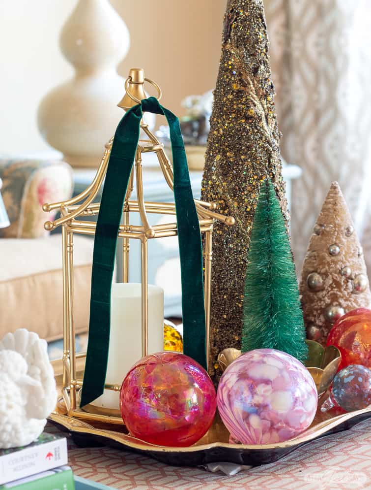 blown glass ornaments and assorted bottlebrush trees on a tray