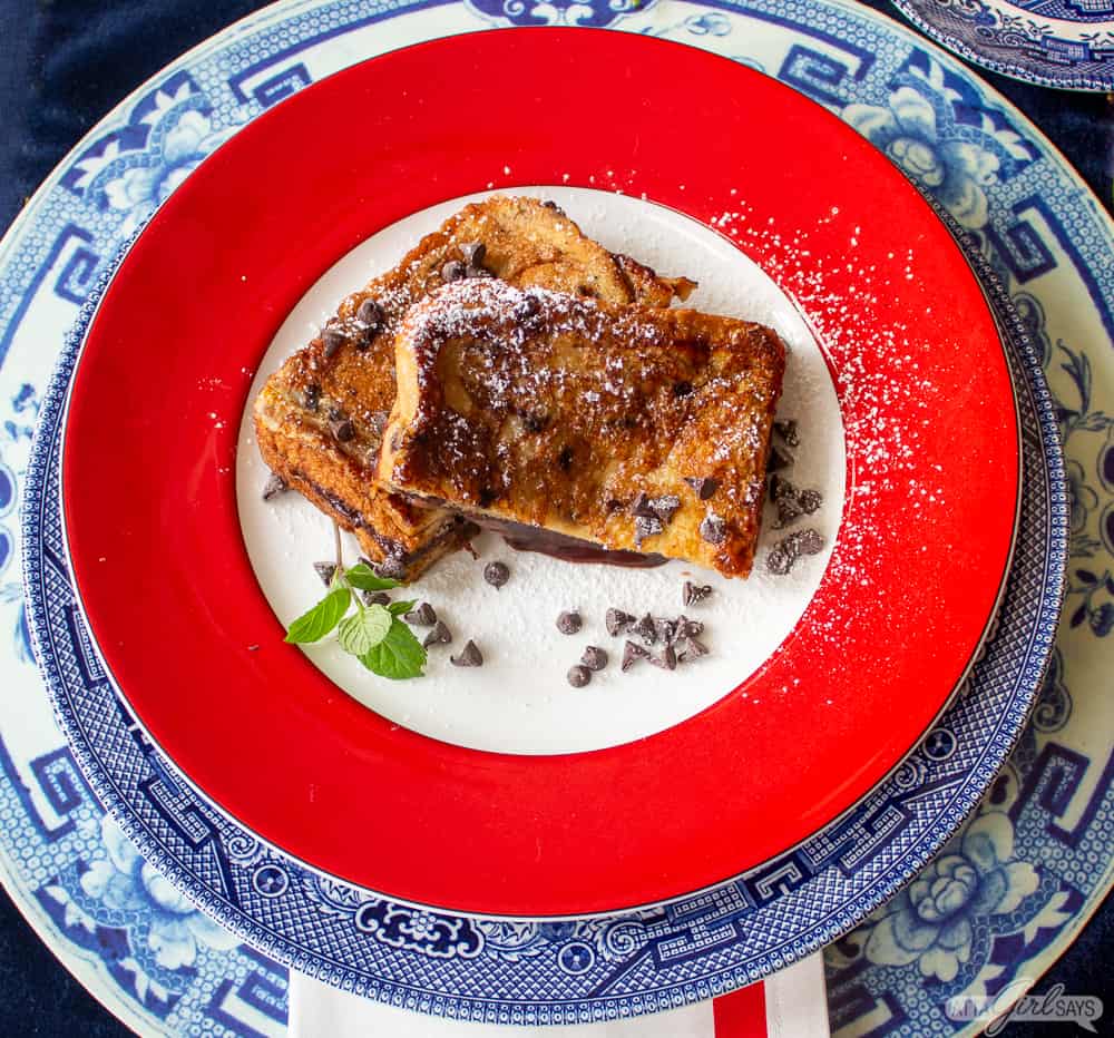 two slices of chocolate Nutella French toast on a red plate