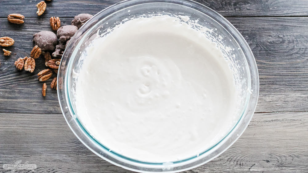 sweet cream cheese dip in a glass mixing bowl
