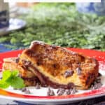 chocolate french toast stuffed with hazelnut spread on a red rimmed plate