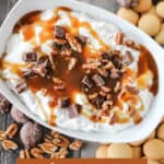 bowl of chocolate caramel pecan candy dip