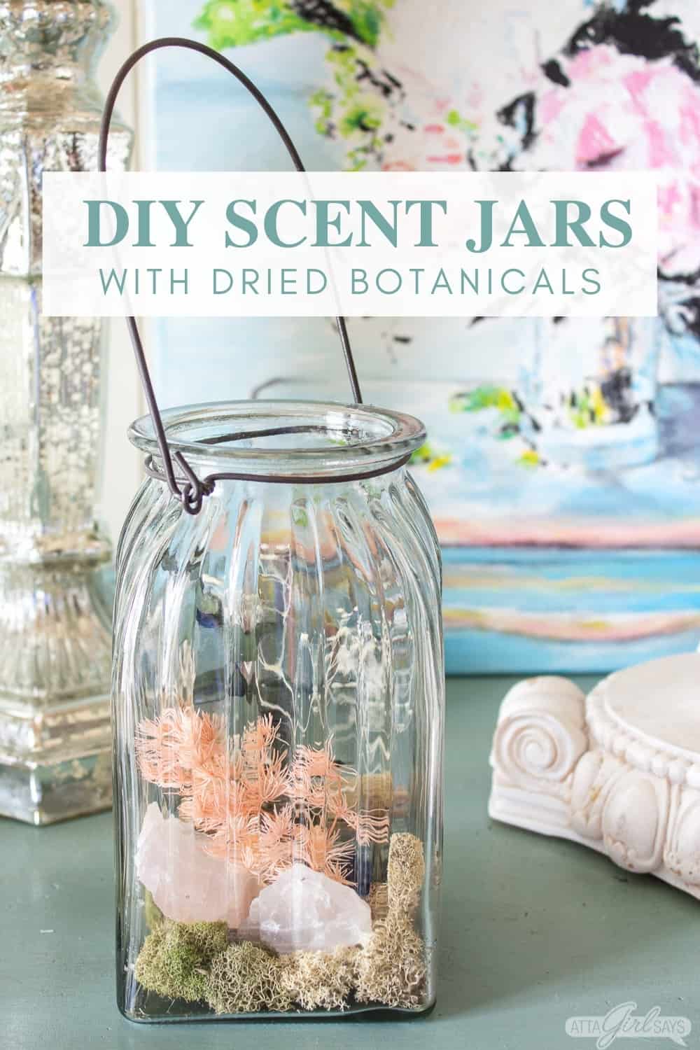 glass jar filled with homemade potpourri, moss and rocks