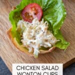 chicken salad, lettuce and a tomato slice in a baked wonton cup