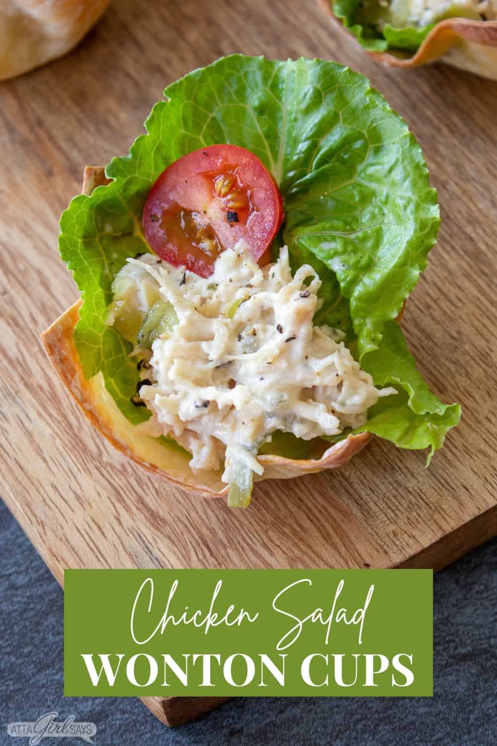 chicken salad, lettuce and a tomato slice in a baked wonton cup