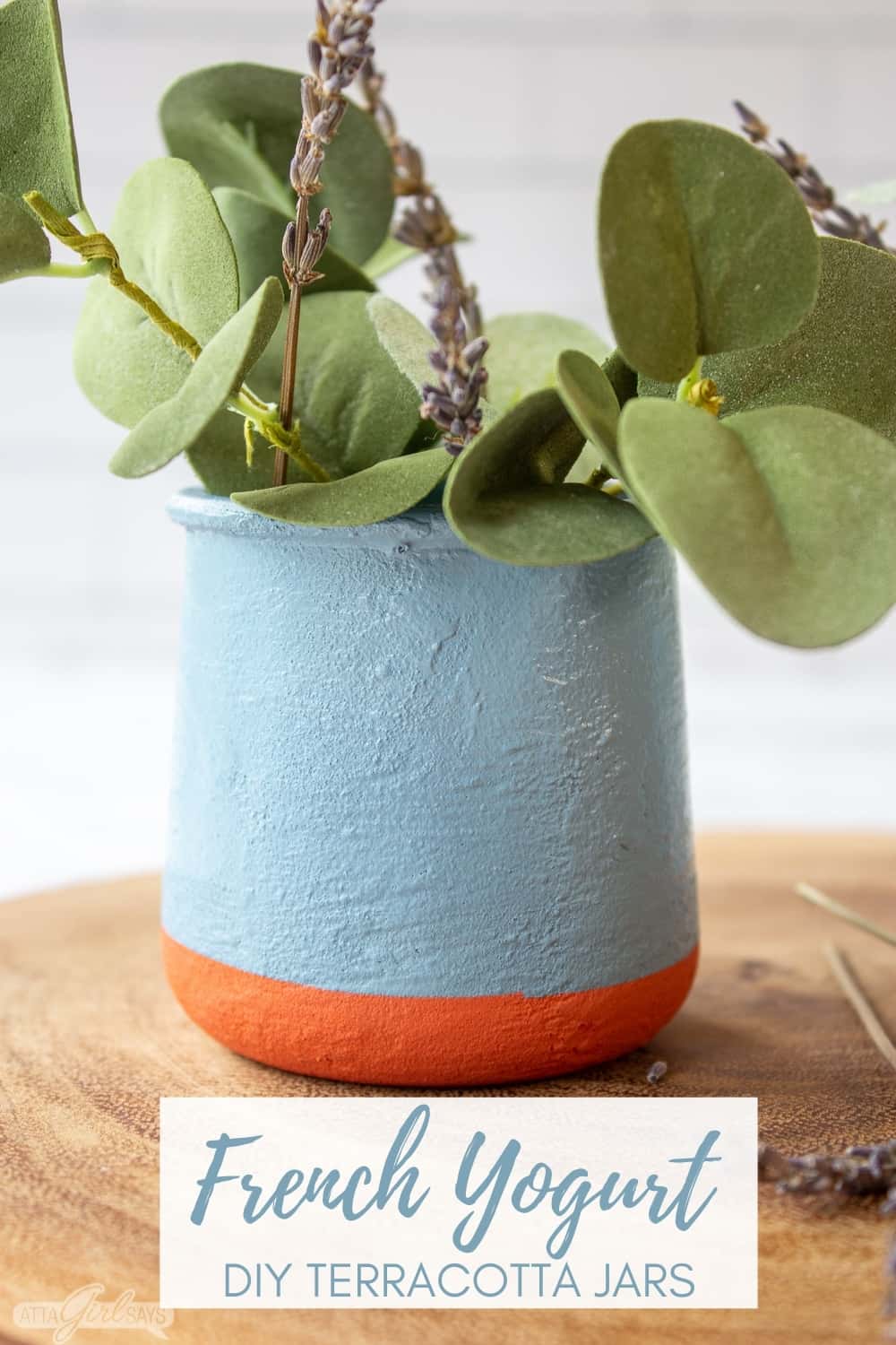 DIY La Fermiere French yogurt jar filled with eucalpytus and lavender on a wooden charger