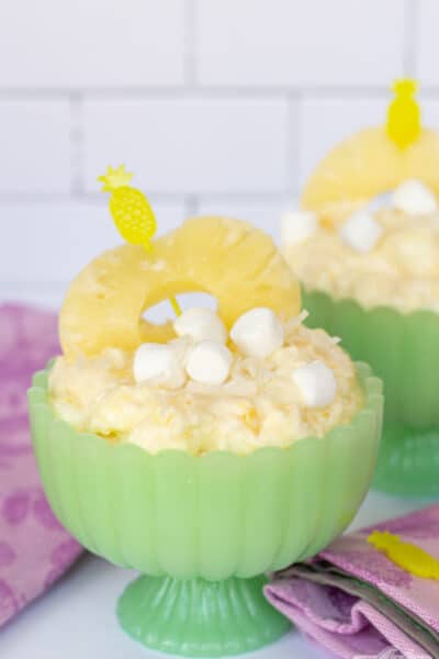 two green jadeite compotes with a fruit fluff dessert