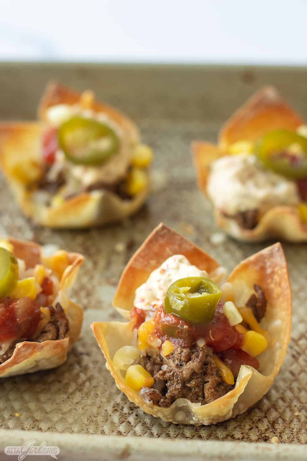 taco wonton cups on a baking pan