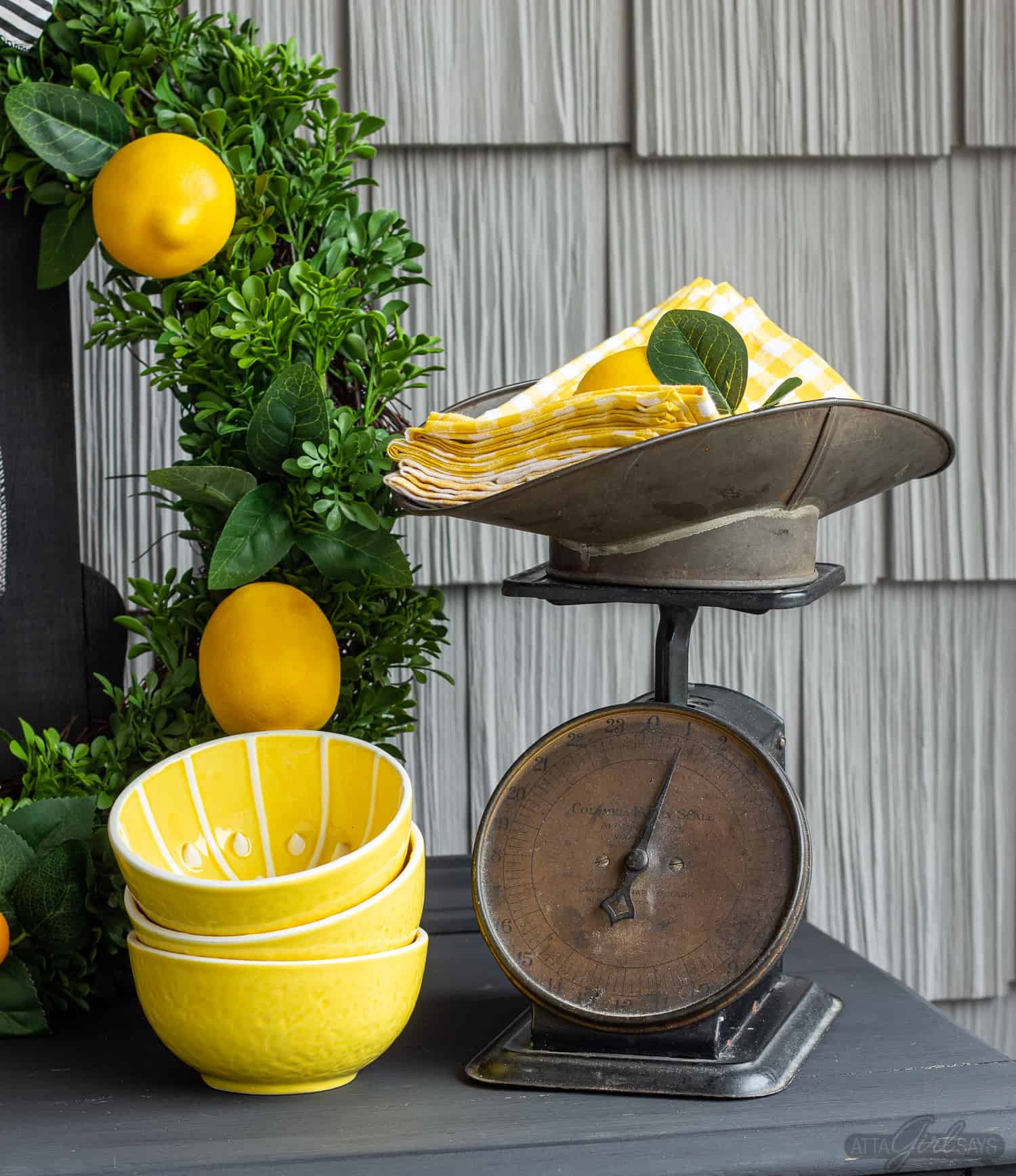 vintage scale with yellow gingham napkins on a buffet server