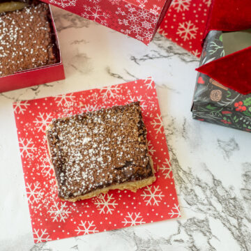 chocolate chess pie bar on a snowflake napkin