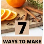 oranges, cinnamon sticks, spices and rosemary on a cutting board with a text overlay