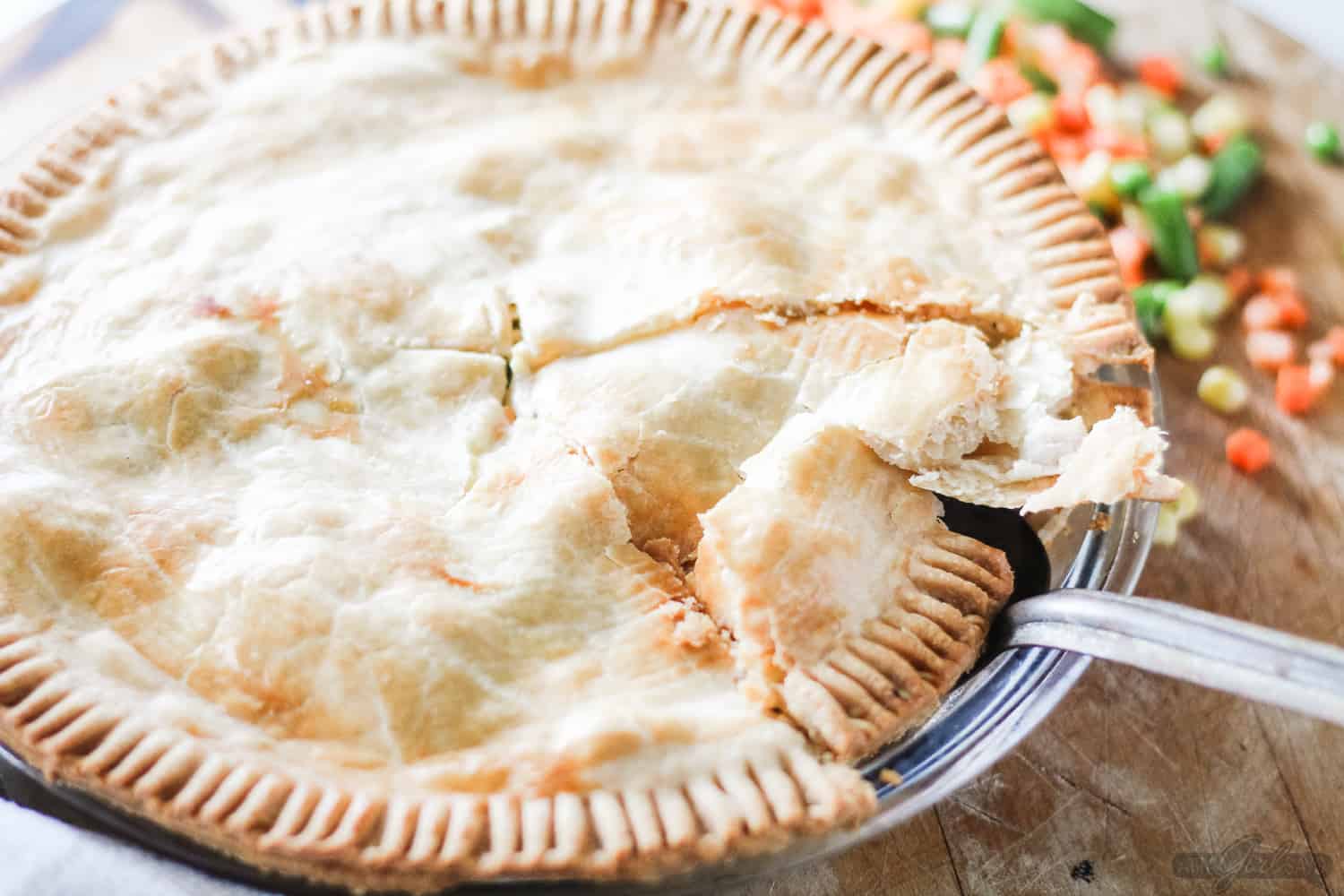 serving a slice of chicken pie