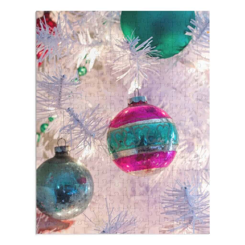 photo puzzle of pink and green Shiny Brite ornaments on a white Christmas tree