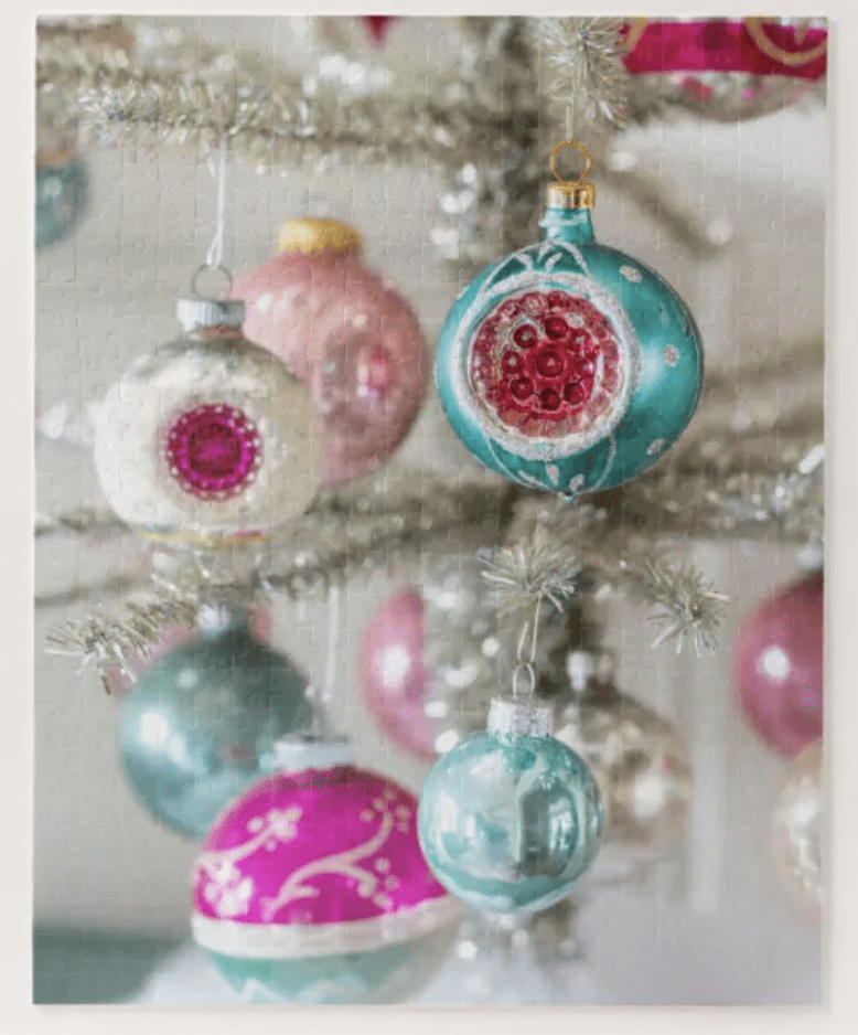 pink and green shiny brite ornaments on a silver tinsel tree