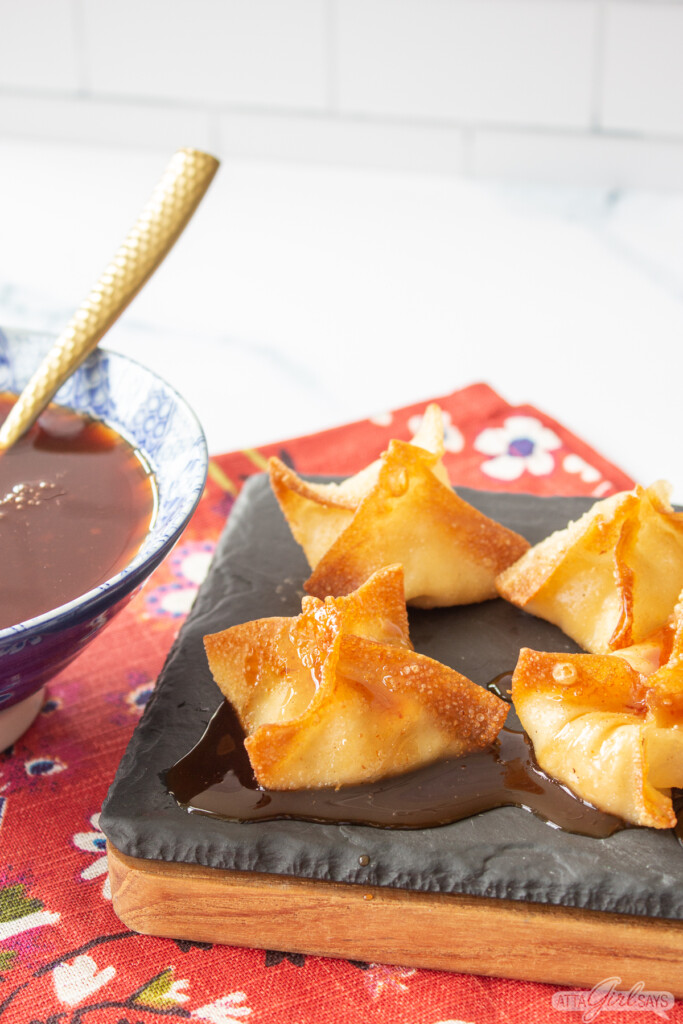 sweet and sour sauce drizzled on crab wontons
