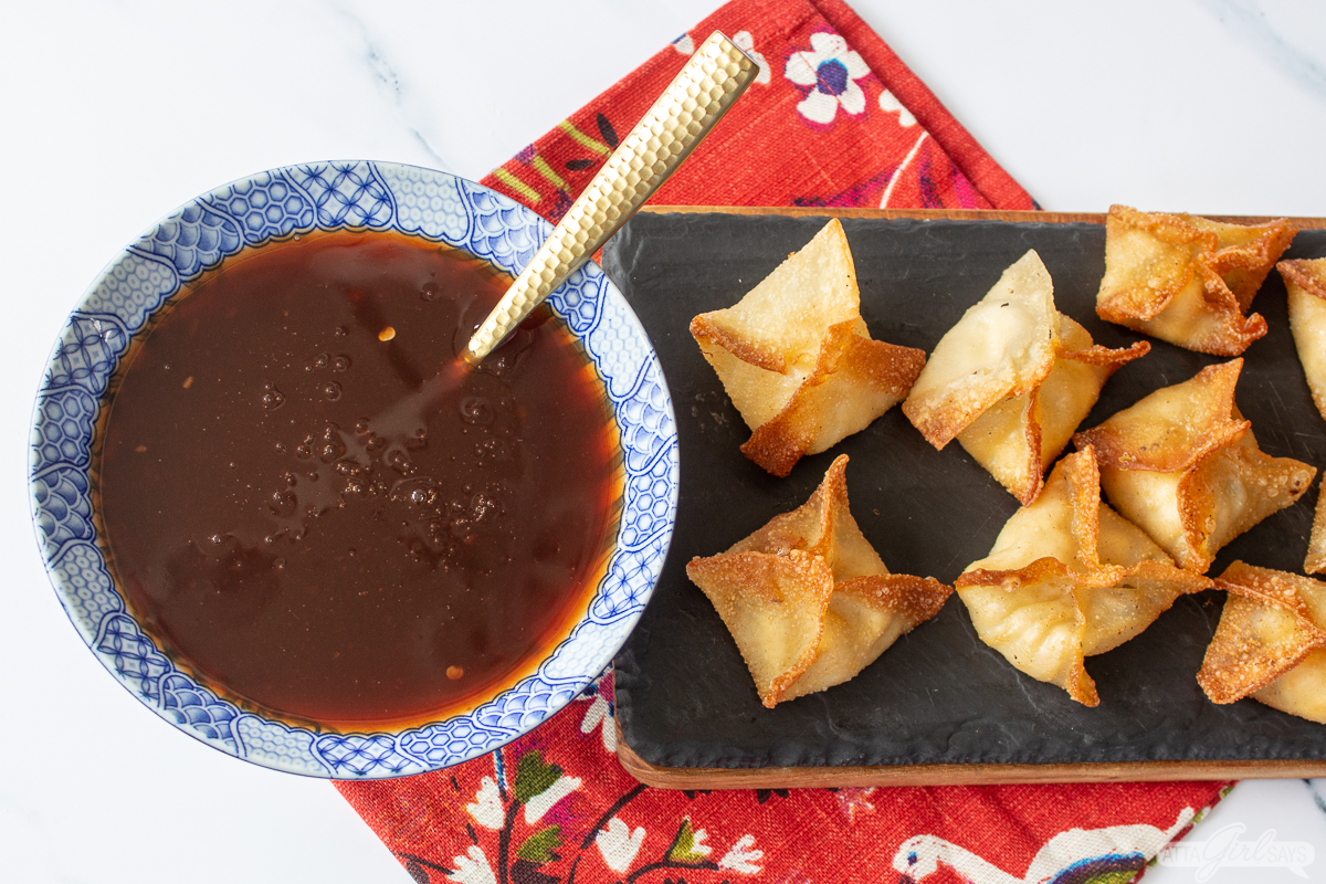 bowl of sweet and sour sauce with crab puffs