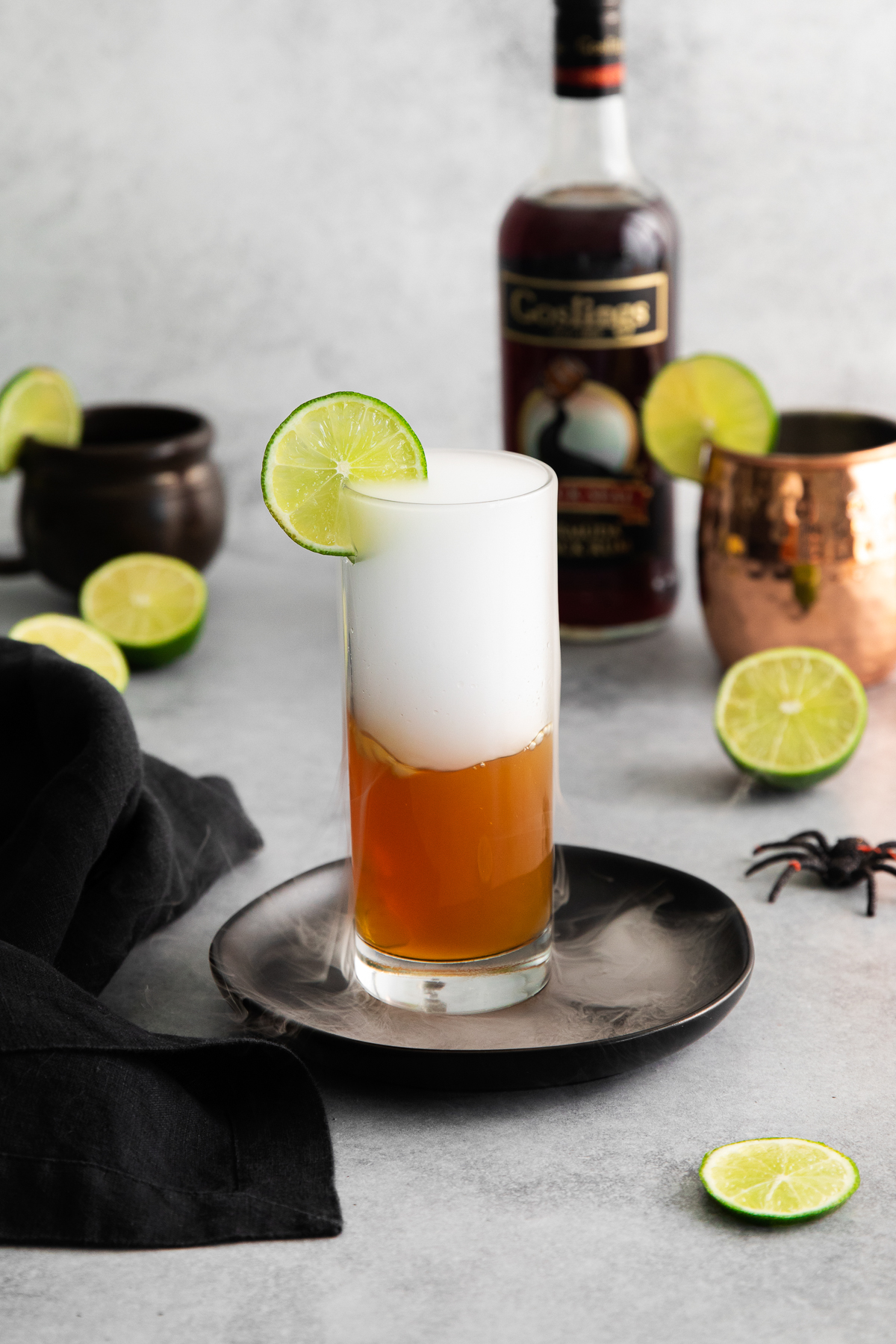dark and stormy cocktail with dry ice smoke