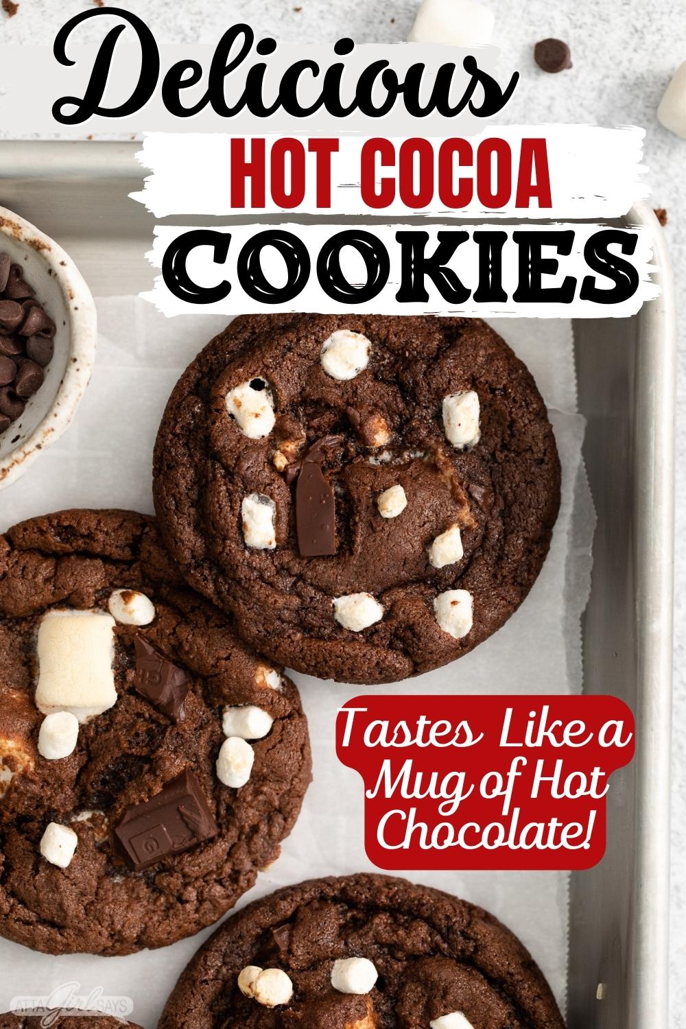 hot cocoa cookies with marshmallows on parchment with a title