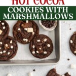 hot cocoa cookies with marshamllows on a baking sheet